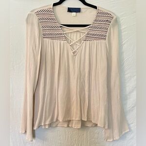 Women’s size small cream v-neck with purple details at neckline